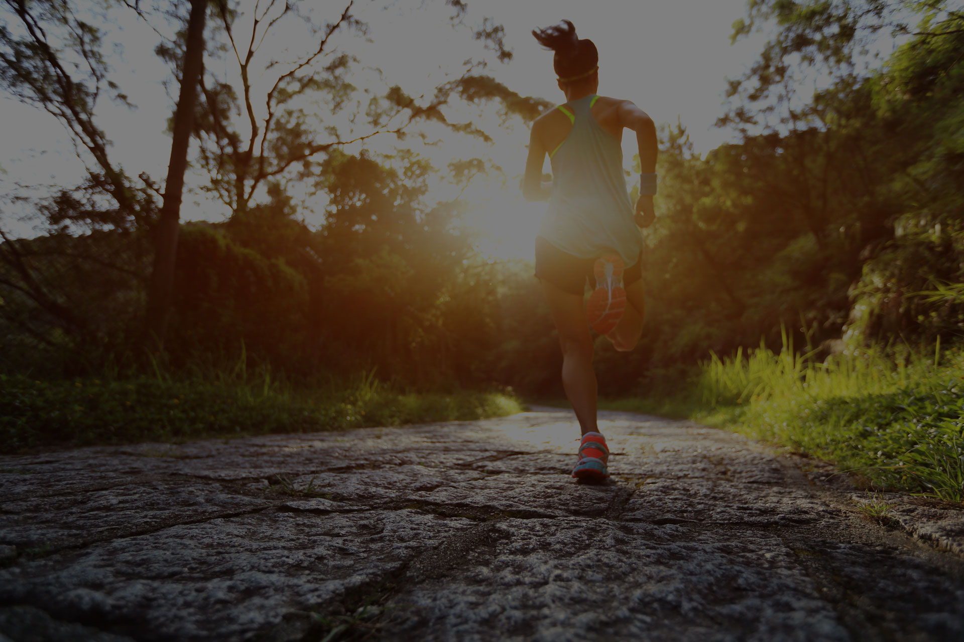 Runner athlete running on forest trail